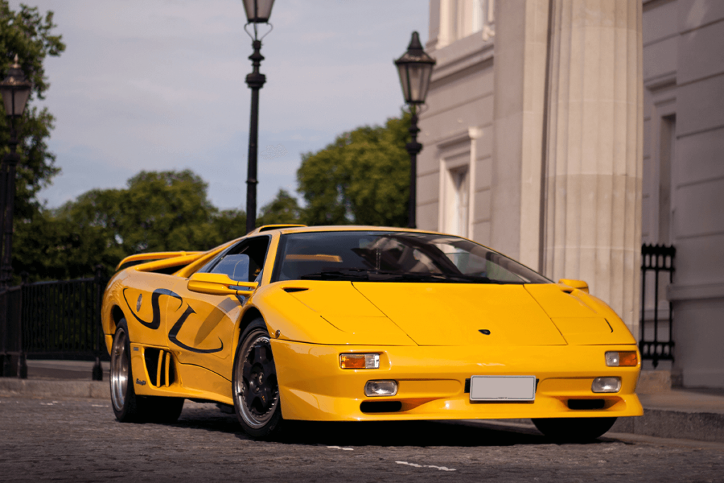 Yellow Lamborghini Diablo outside a building